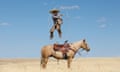 Airborne … a Mexican Charro executes a rope drill on top of his horse.
