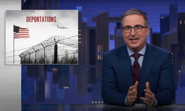 man in suit speaks with hands gestured