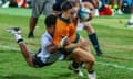 Desiree Miller runs in a try for Wallaroos in their victory over Fijiana