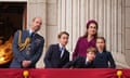 prince and princess of wales and family watch a fly-past at buckingham palace