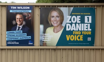 Tim Wilson and Zoe Daniel signs