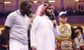Canelo Álvarez, right, and Terence Crawford, left, face off in the ring after Álvarez’s win over William Scull on Sunday morning in Riyadh.