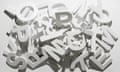 A pile of various white block letters