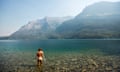 A female about to take a swim in a cool lake