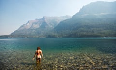 A female about to take a swim in a cool lake
