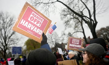 Activists hold up placards