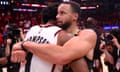 The Warriors’ Stephen Curry, right, embraces the Rockets’ Amen Thompson at the end of Sunday night’s Game 7 of their first-round series. 