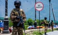 Indian paramilitary soldiers stand guard in Srinagar in Indian-administered Kashmir.