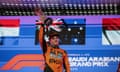 Race winner Oscar Piastri celebrates on the podium at the Saudi Arabian F1 Grand Prix at Jeddah Corniche Circuit.